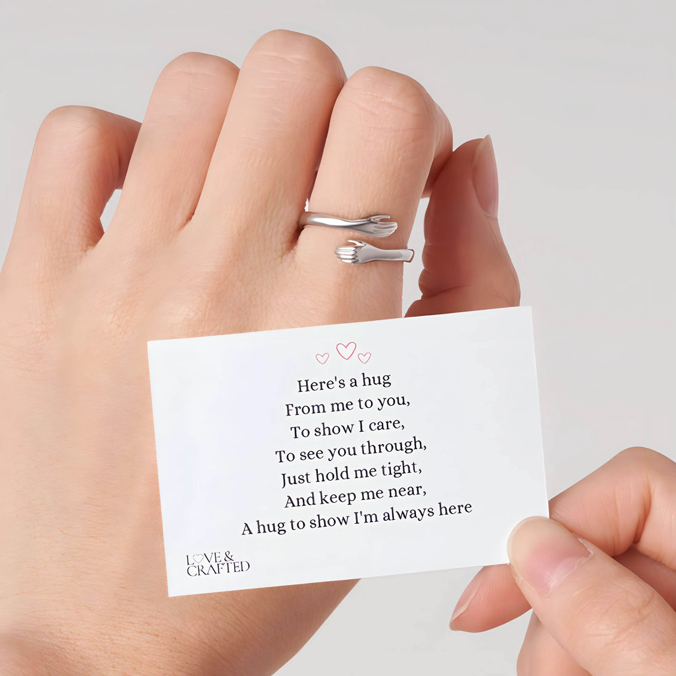 Silver Hug Ring displayed from a front angle